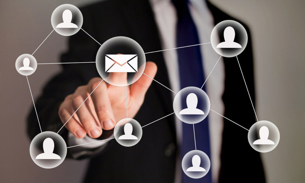 AI Automation for Small Businesses: 10 Smart Ways to Save Time and Increase Profits in 2026 email and contact symbols in front of businessman